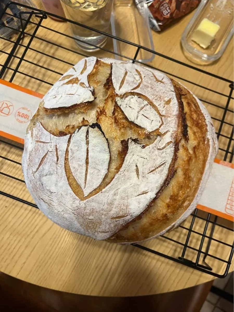 Classic sourdough loaf with a leaf pattern scored on top