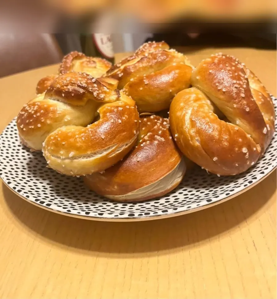 Plate of sourdough soft pretzels topped with coarse salt